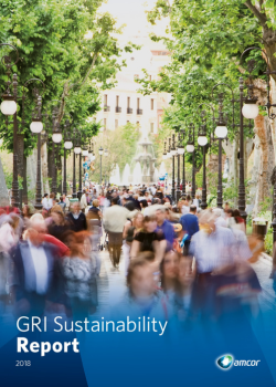 A vibrant, blurred city street scene filled with people walking along a tree-lined promenade. The bustling crowd and lush greenery create a dynamic yet serene atmosphere. The text &#34;GRI Sustainability Report 2018&#34; is positioned in the lower part of the image with the &#34;Amcor&#34; logo. The image suggests a focus on sustainability within busy urban environments and the importance of sustainable practices for large populations.